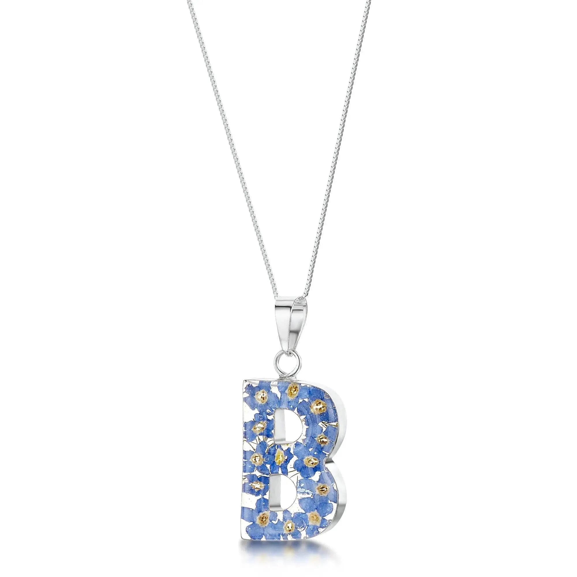 Initial pendant necklace with real forget me not flowers by Shrieking Violet® Ideal birthday gift.